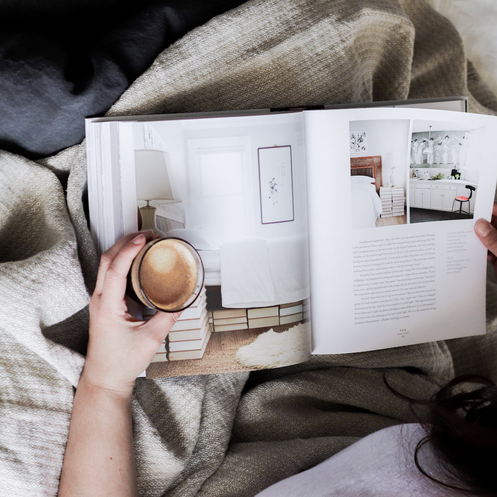 woman reading book with coffee