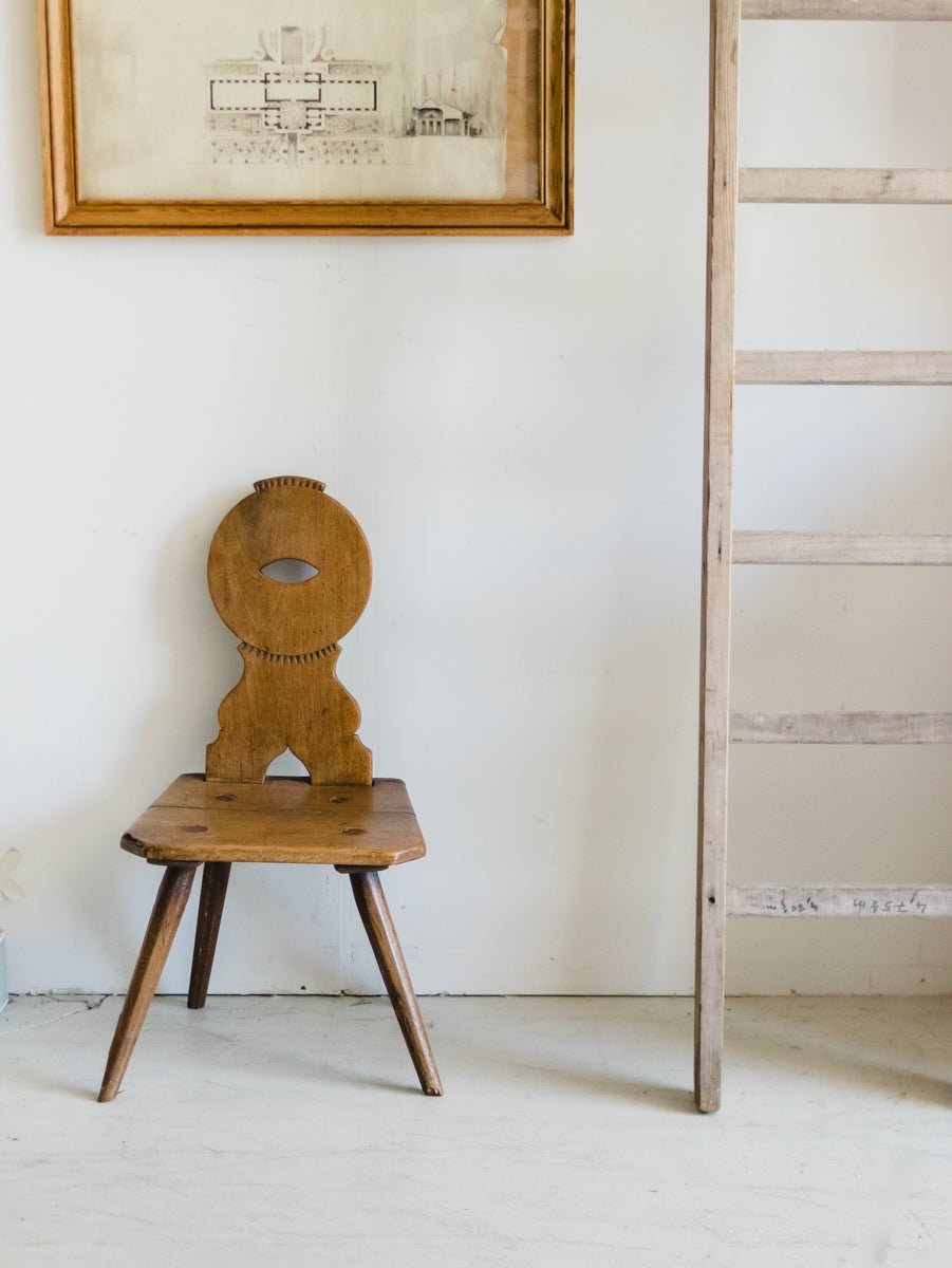 alsacian chair with ladder and art
