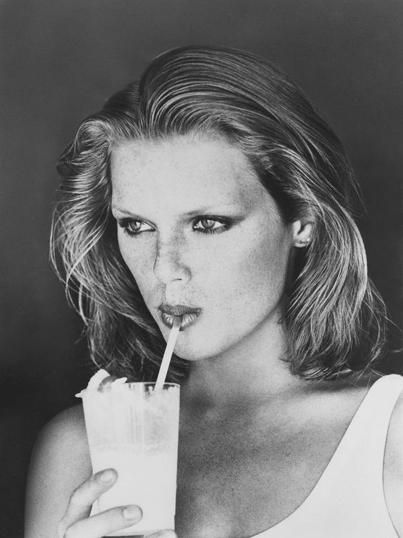 woman drinking through straw
