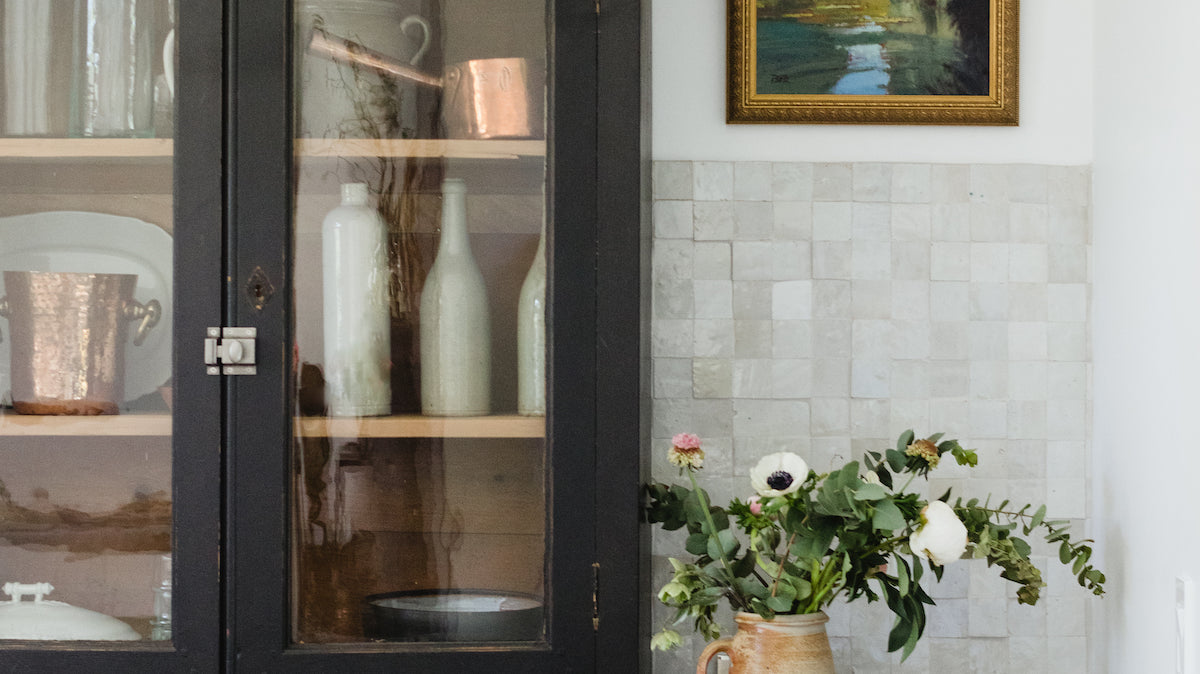 green kitchen with vintage vitrine
