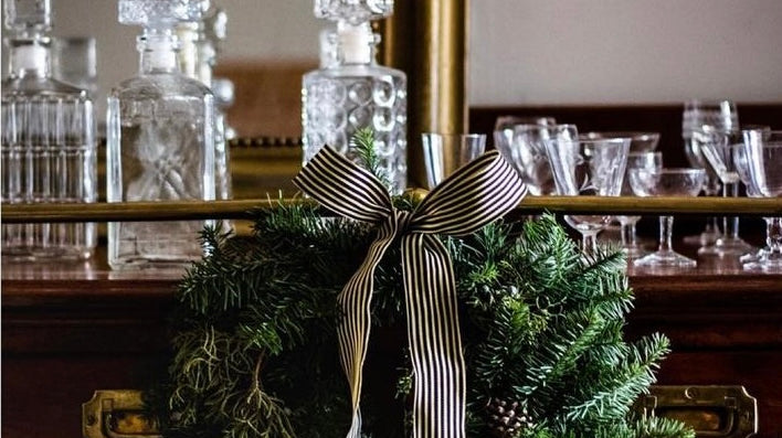 elsie green christmas wreath on bar cart french bar glassware