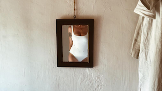 white swimsuit in mirror
