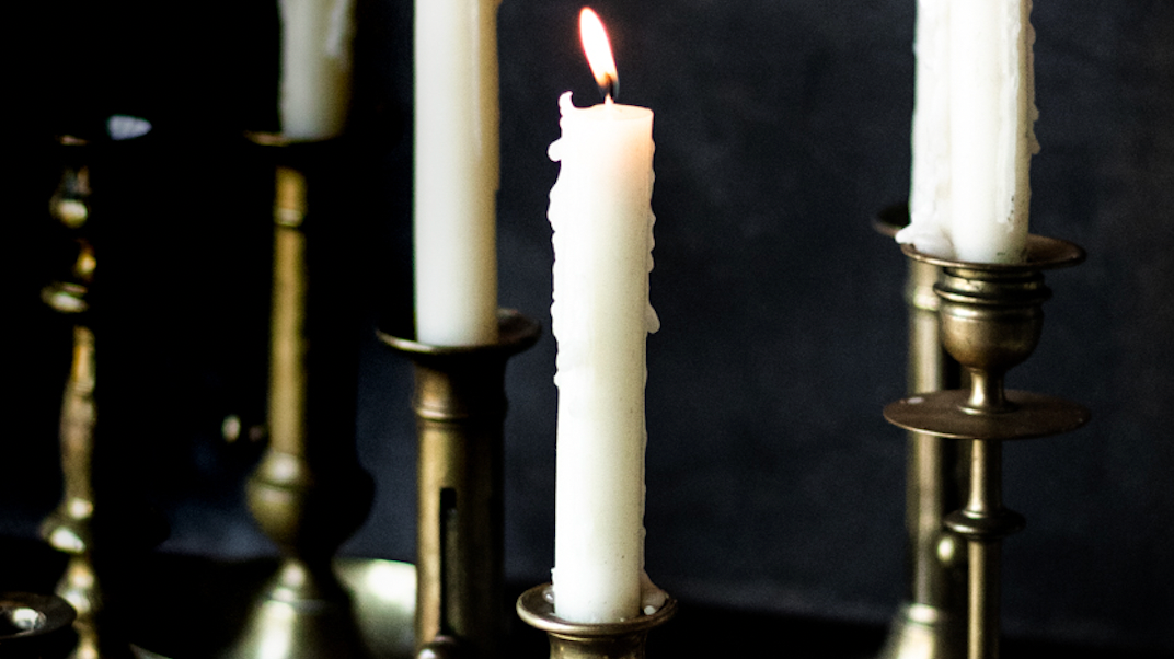 woman lighting candles