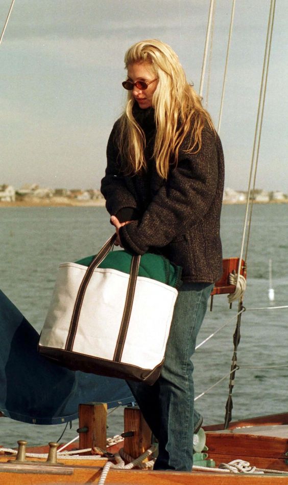 woman on boat with weekender tote