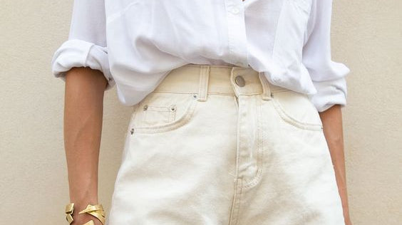 girl in white shorts and white button down