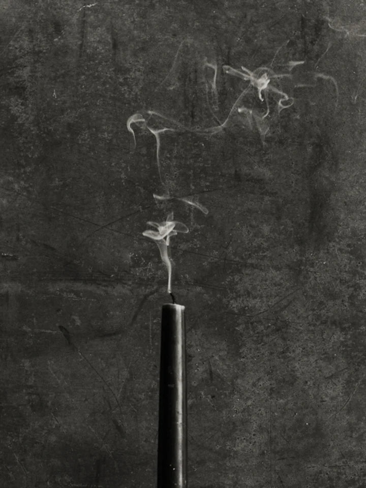 candle blown out with smoke