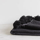 Moroccan Pom Pom Throw - elsie green - Textiles
