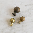 Set Of 9 Brass Knobs - elsie green - decor