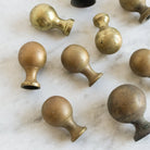 Set Of 9 Brass Knobs - elsie green - decor
