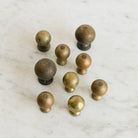 Set Of 9 Brass Knobs - elsie green - decor